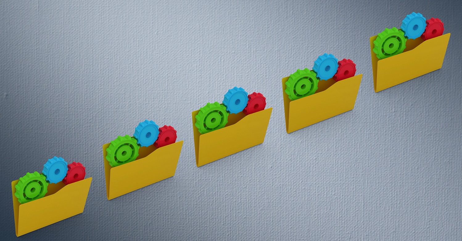 File folder with gears against grey background